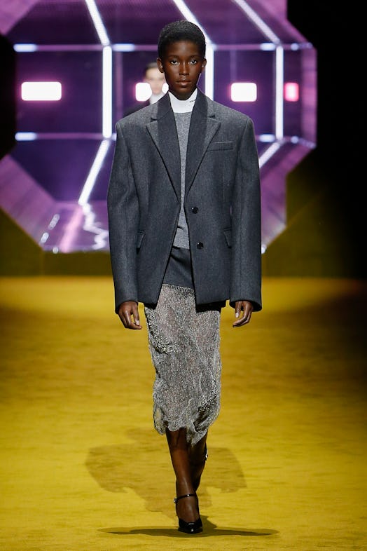model wearing prada fall winter 2022 blazer, sweater and sheer skirt