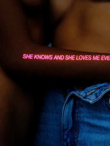 A portrait of lower torso showing a man and woman hugging with a saying "she knows and she loves me ...