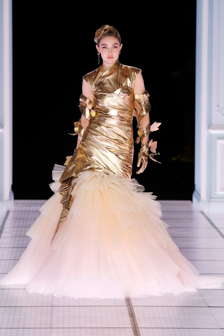 Gigi Hadid walks the runway at the Moschino fashion show during the Milan Fashion Week Fall/Winter 2...