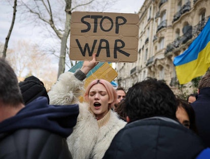 The model Pasha Harulia protesting the Ukraine-Russian war with a "Stop War" sign