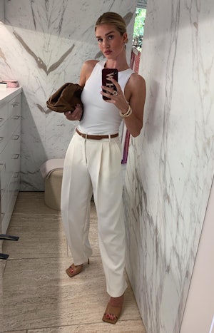 Rosie Huntington-Whiteley wears Zara white halter neck bodysuit.
