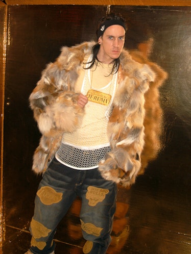 Jeremy Scott wearing a fur coat 