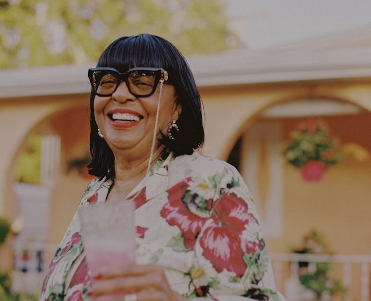 Jeremy Pope's grandmother Ann Hardison wearing a floral Gucci dress and sunglasses