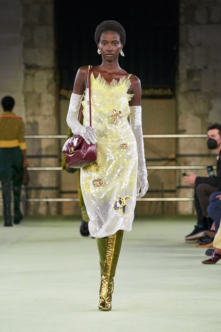 Model in sheer yellow dress at Bottega Veneta fall 2022