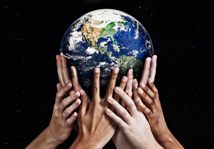 Hands holding the Earth