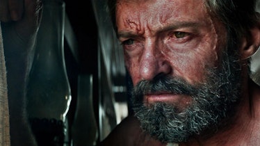 Hugh Jackman looking out a window as Wolverine in 2017's Logan