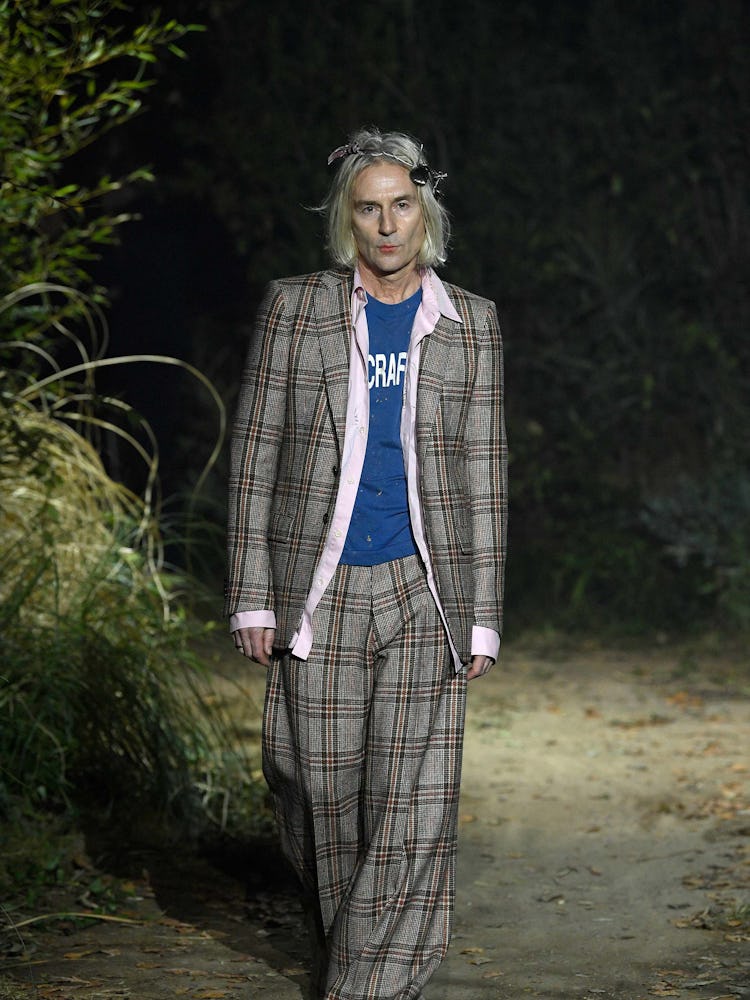 A model in a plaid suit at Marni fall 2022 Milan fashion week  