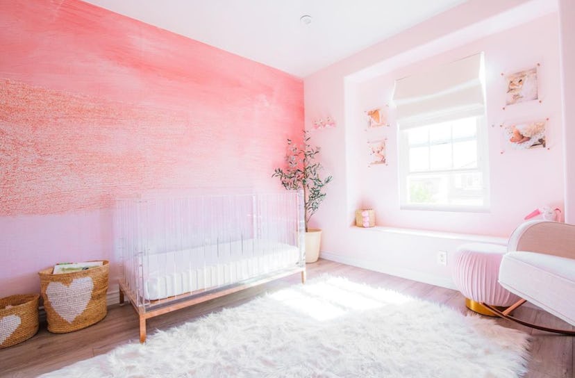 Baby girl nursery with pink ombre wall