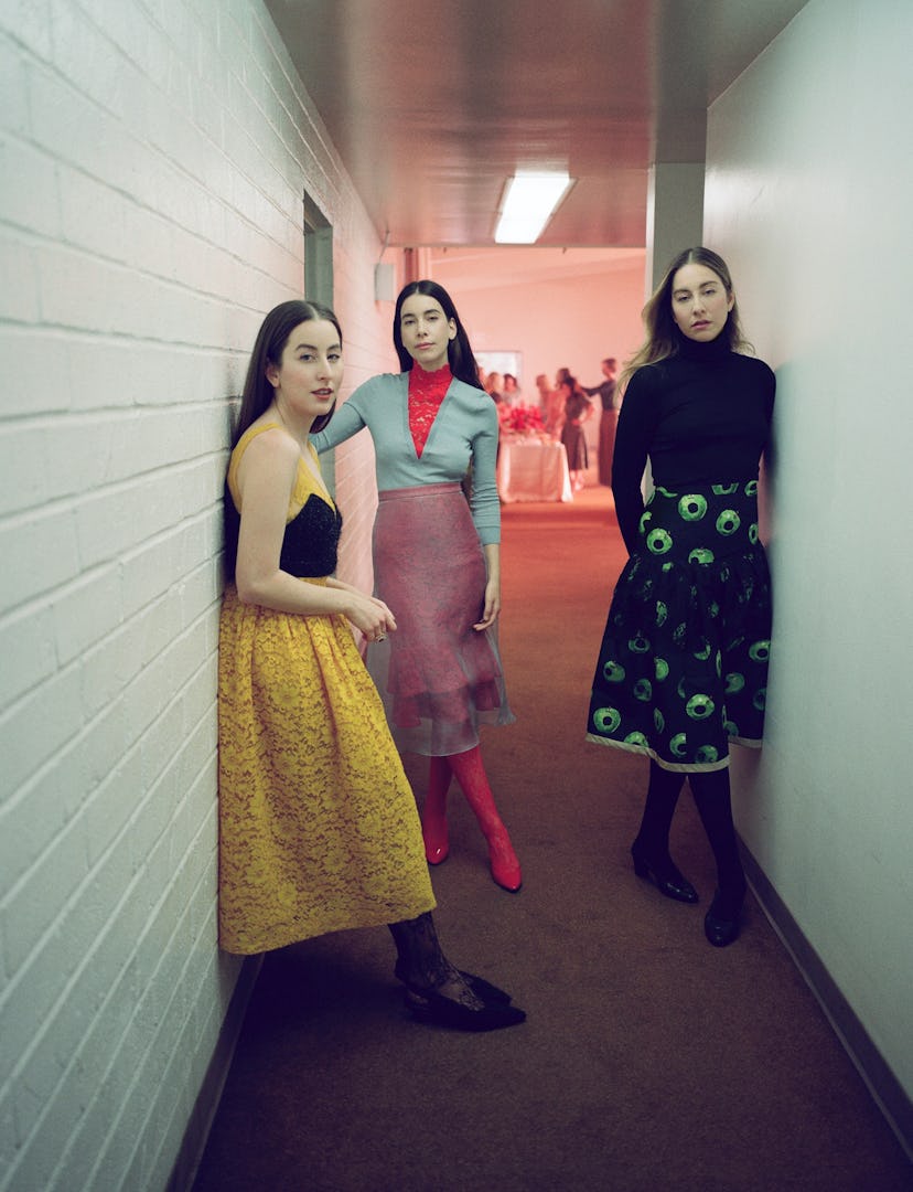 Haim the band in a hallway.