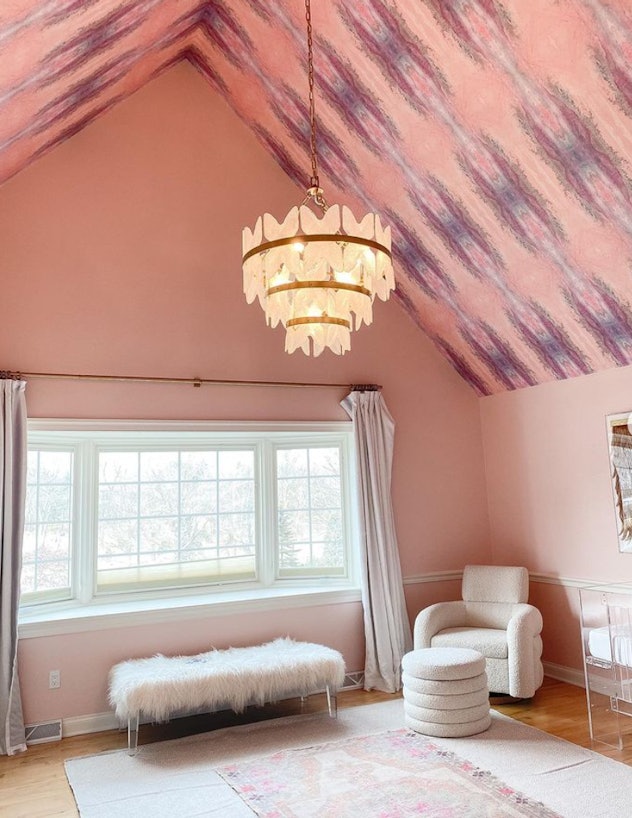 Baby girl nursery with wallpaper ceiling