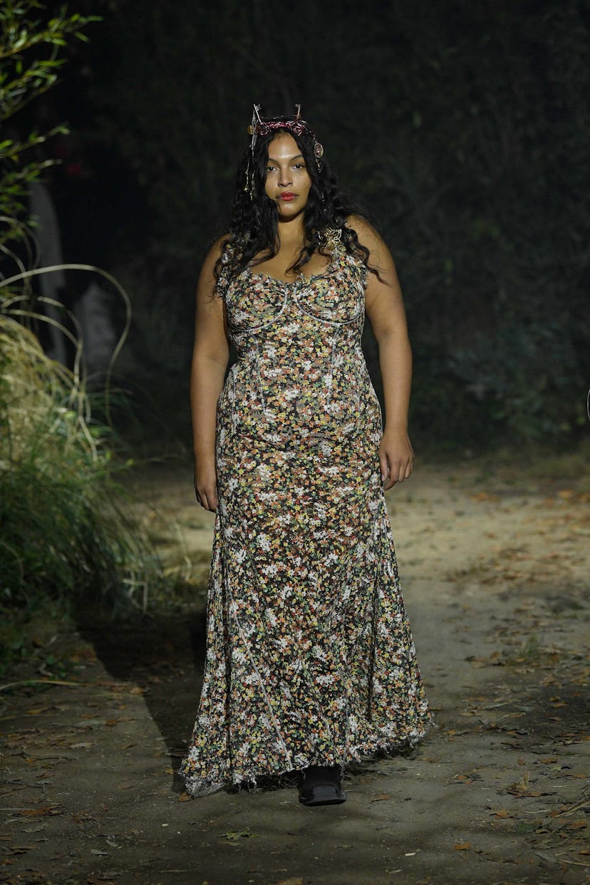 A model in a Marni floral dress and black chunky heels