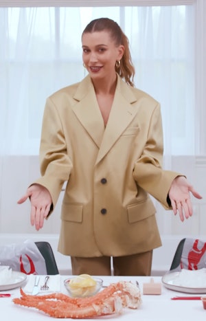 Hailey Bieber wearing a bralette in her latest YouTube video. 