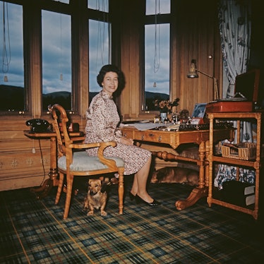 The Queen sitting at her desk in Balmoral Castle