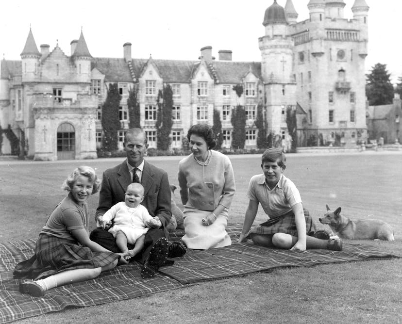 Queen Elizabeth II and her family sitting outside their Balmoral home