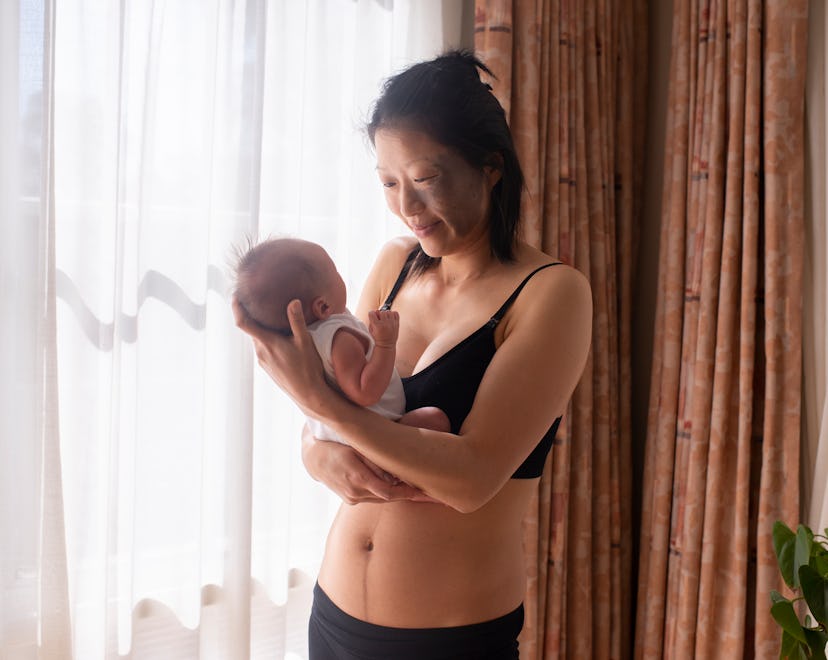 mother with newborn holding baby