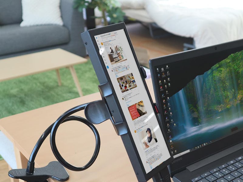 A 5:19 side monitor for scrolling Twitter.