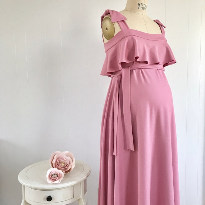 Mannequin in pink maternity dress 