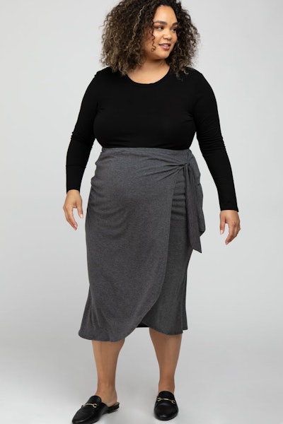 Pregnant woman modeling grey wrap skirt