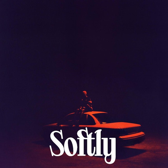 Cover of Arlo Park's song "Softly" with a man standing on a car in the red light.
