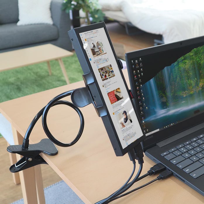 Thanko's portable ultra-tall monitor attached to a desk clamp.