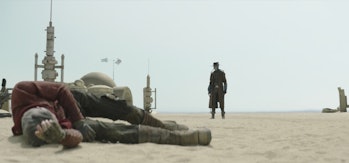 Cad Bane looking at Cobb Vanth's downed body in The Book of Boba Fett Episode 6