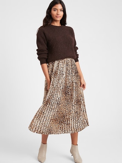 Woman modeling pleated skirt
