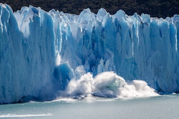 Ice crashing into sea from glacier