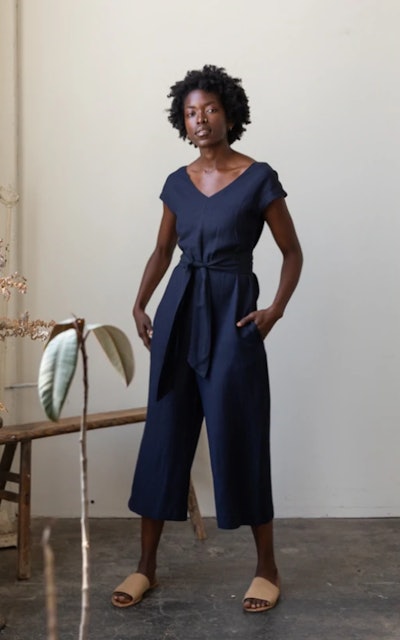 Woman modeling navy blue jumpsuit 