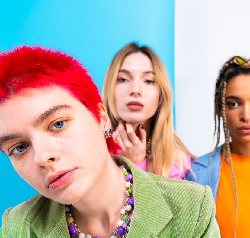 Three young female-presenting friends, wondering if their Sagittarius-Pisces friendship is compatibl...