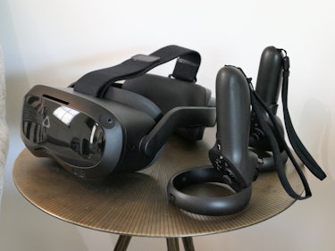 The Vive Focus 3 and its controllers sitting on a side table 
