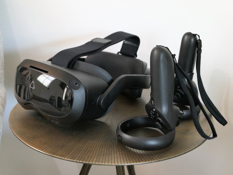The Vive Focus 3 and its controllers sitting on a side table 