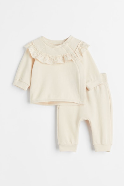 Flat lay of two-piece baby set; pants and top