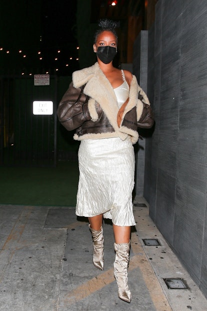 Rihanna was seen leaving Nobu restaurant in West Hollywood after dinner in a white dress and boots, ...