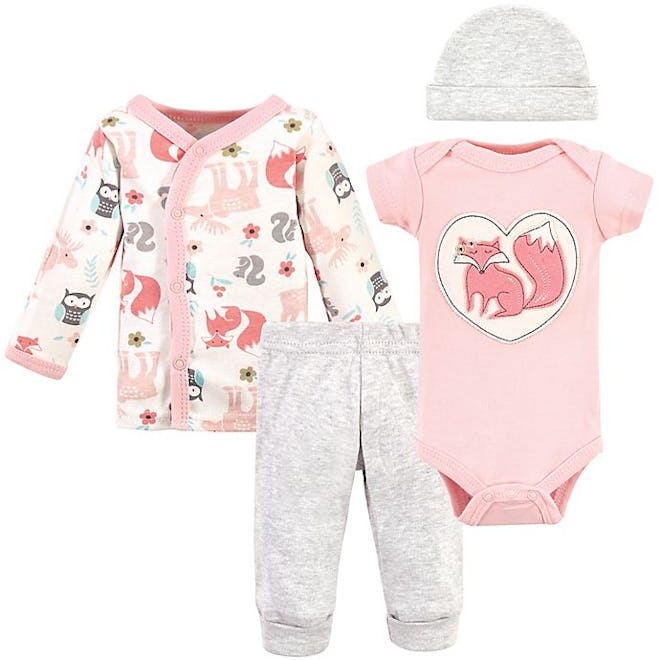 flat lay of four-piece preemie baby clothing set; onesie, longsleeve shirt, pants, and hat