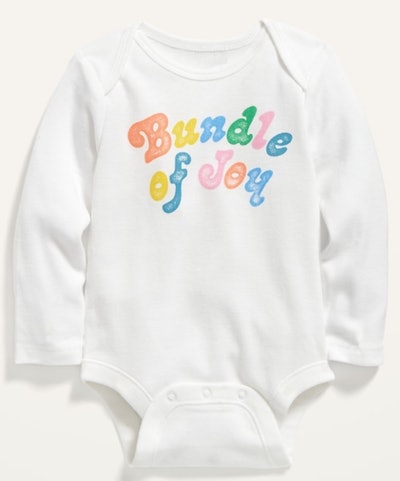 Flat lay of baby onesie that says "bundle of joy"