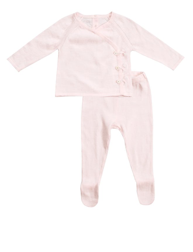 Flat lay of two-piece pink baby outfit