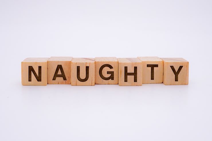 Naughty Word Written In Wooden Cube