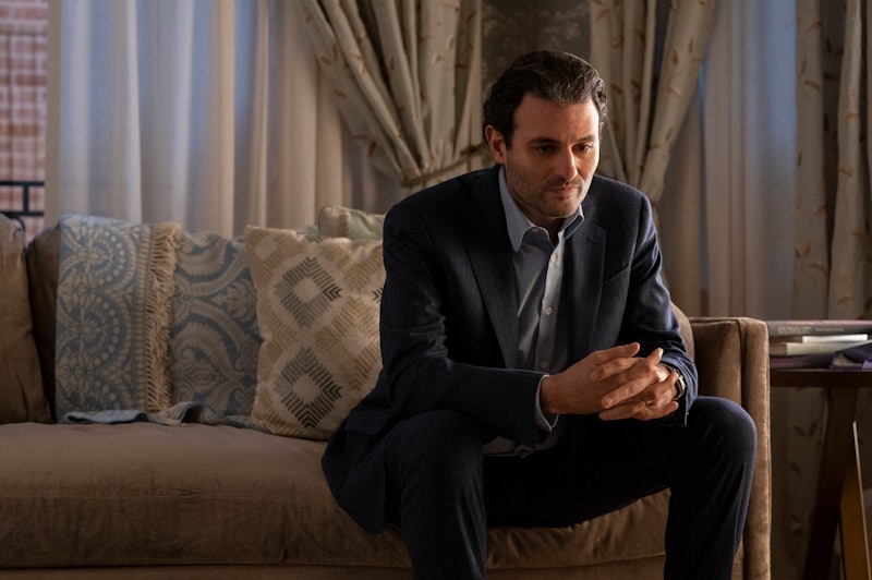 Arian Moayed as Anna Sorokin's lawyer Todd Spodek in 'Inventing Anna.' He is in a suit and sitting o...