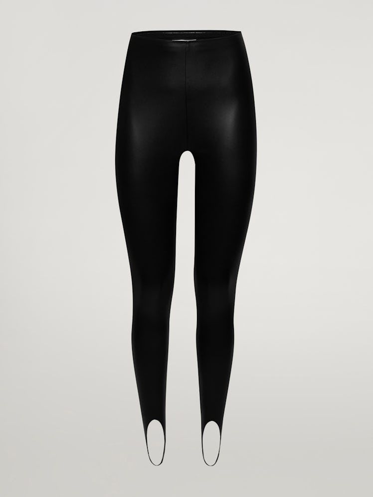 Amina Muaddi x Wolford black vegan leather stirrup leggings.