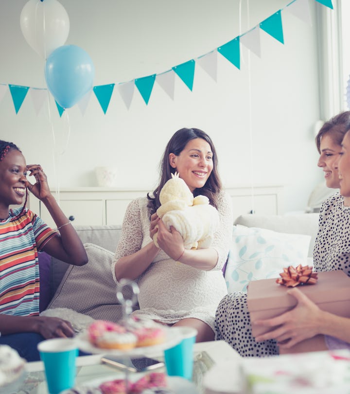 friends at a baby shower wearing different outfits