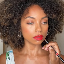 Logan Browning in Red lipstick 
