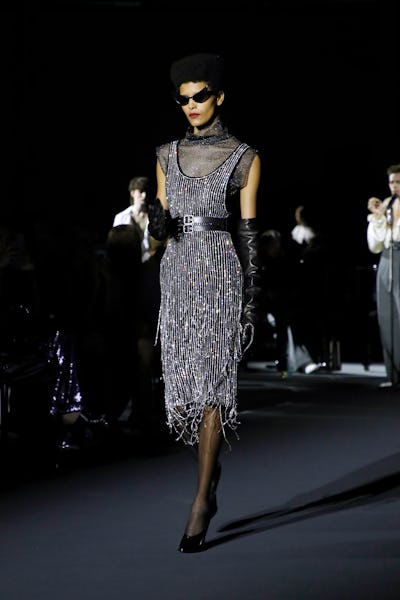 A model wearing a silver beaded fringe dress on the Philosophy di lorenzo Serafini runway