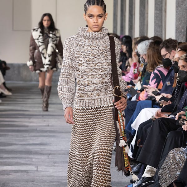 a model wearing a sweater a knit maxi skirt on the Etro runway