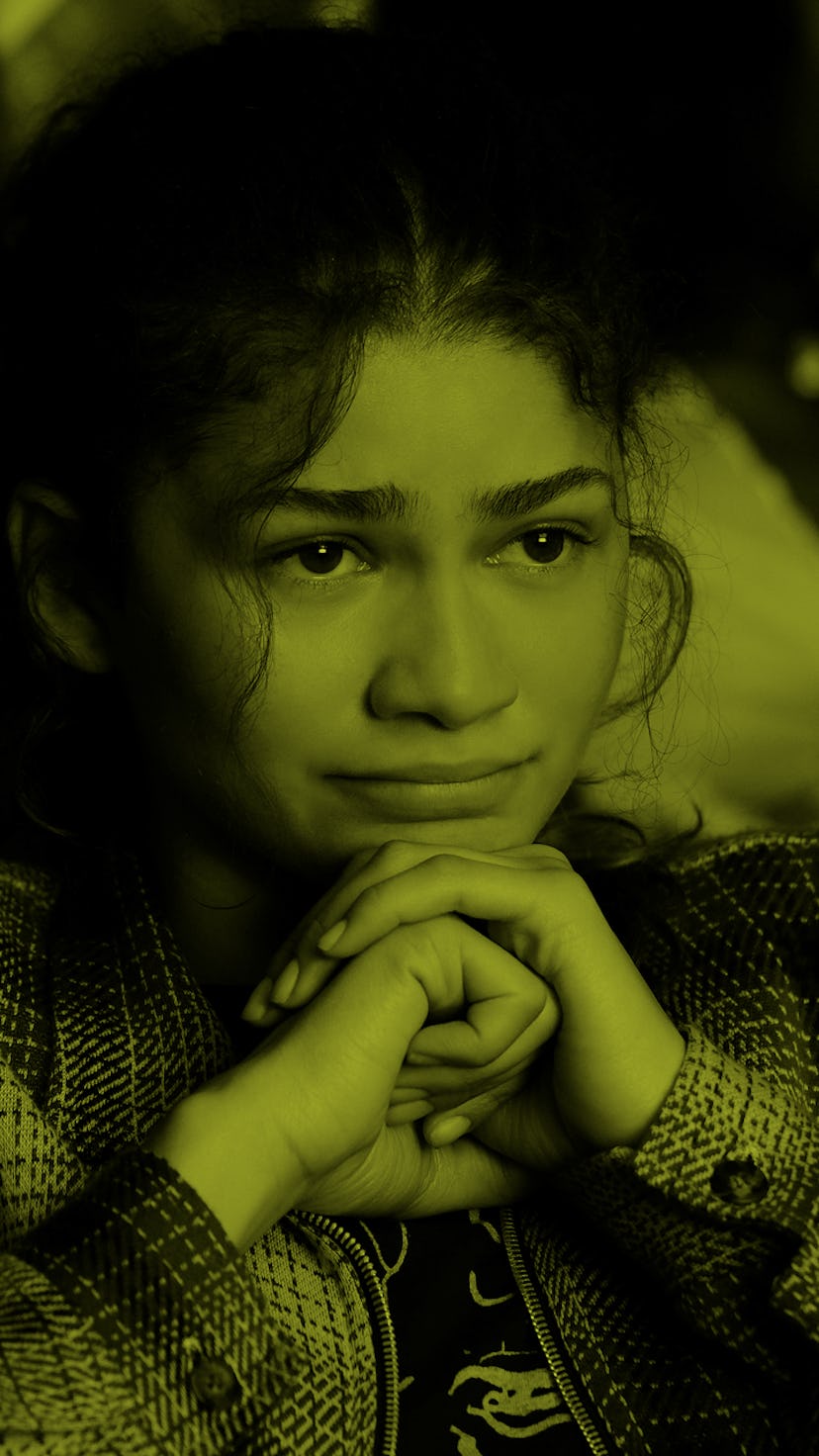 Zendaya, from "Euphoria", sitting down with hands under her chin, looking like she is close to tears...