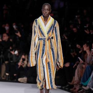 a model wearing a striped sequin robe on the Missoni runway