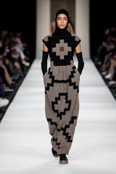 a model wearing a knitted maxi dress on the Max Mara runway