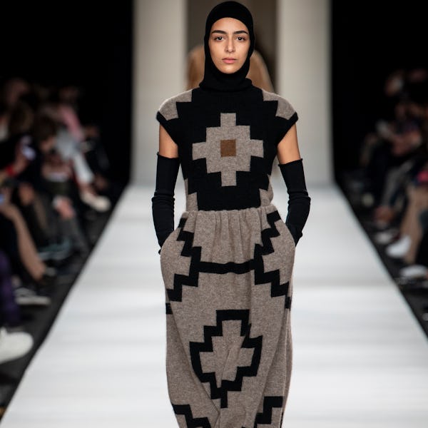 a model wearing a knitted maxi dress on the Max Mara runway