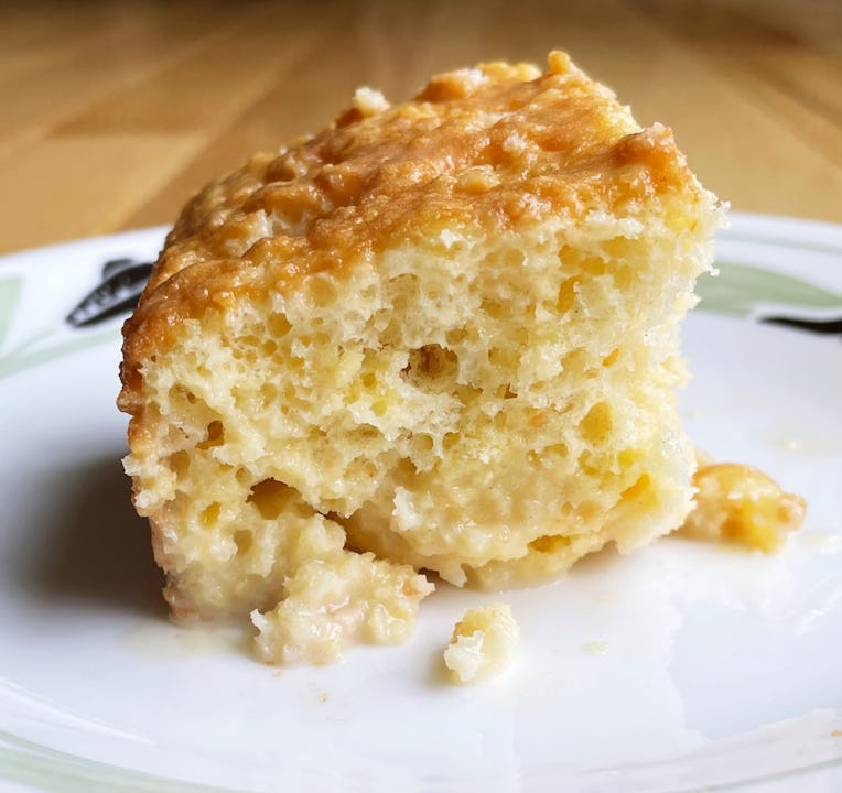 A slice of tres leches cake on a plate.