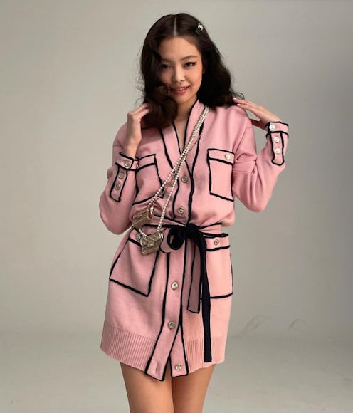 Blackpink's Jennie Kim wearing a pink Chanel outfit.