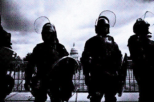 Police in riot gear provide security as demonstrators gather for the "Justice for J6" rally in Washi...